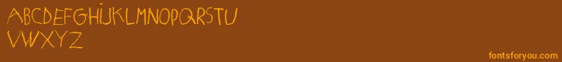 MatildasGradeSchoolHandDemoPrint Font – Orange Fonts on Brown Background