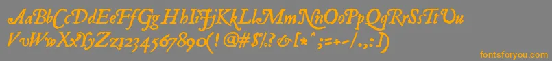 フォントJancieni – オレンジの文字は灰色の背景にあります。