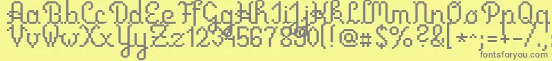 Czcionka Primusscript – szare czcionki na żółtym tle