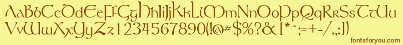 フォントGsttolrm – 茶色の文字が黄色の背景にあります。