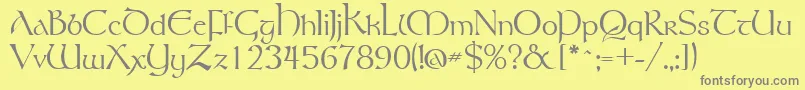 フォントGsttolrm – 黄色の背景に灰色の文字