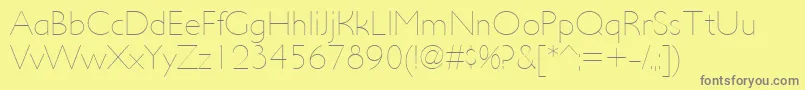 フォントUltimapdacUltralight – 黄色の背景に灰色の文字
