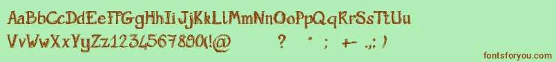 ScriptGribouillon-Schriftart – Braune Schriften auf grünem Hintergrund