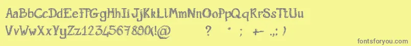 Saiba mais sobre a fonte ScriptGribouillon Fonte ScriptGribouillon – fontes cinzas em um fundo amarelo