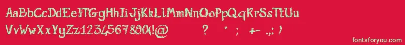 Fonte ScriptGribouillon – fontes verdes em um fundo vermelho