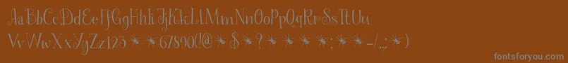 SpinnenkopDemo-Schriftart – Graue Schriften auf braunem Hintergrund