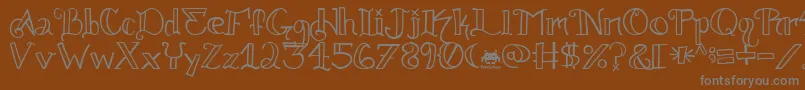 Knuckle.Tatz.Fontvir.Us Font – Gray Fonts on Brown Background