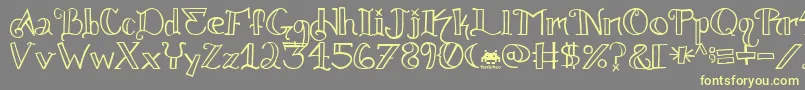 フォントKnuckle.Tatz.Fontvir.Us – 黄色のフォント、灰色の背景