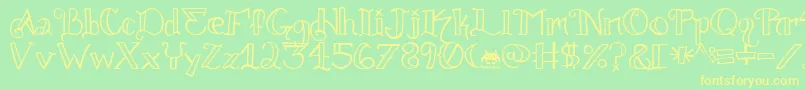 フォントKnuckle.Tatz.Fontvir.Us – 黄色の文字が緑の背景にあります