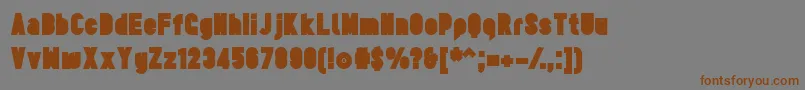 TesUltrablack-Schriftart – Braune Schriften auf grauem Hintergrund