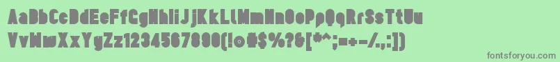 TesUltrablack Font – Gray Fonts on Green Background