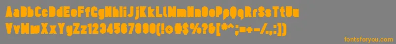 フォントTesUltrablack – オレンジの文字は灰色の背景にあります。