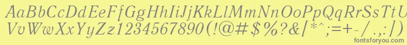 UkAntiqueItalic-Schriftart – Graue Schriften auf gelbem Hintergrund