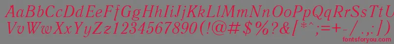 フォントUkAntiqueItalic – 赤い文字の灰色の背景