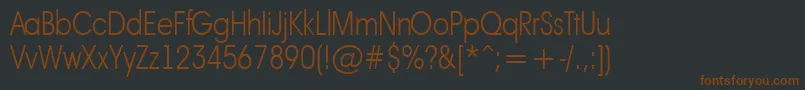 フォントAAvanteltnrThin – 黒い背景に茶色のフォント