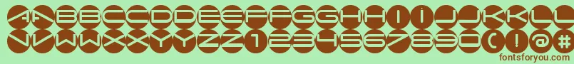 フォントAbcacw – 緑の背景に茶色のフォント