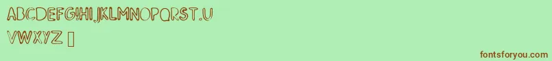 SkMildred-Schriftart – Braune Schriften auf grünem Hintergrund