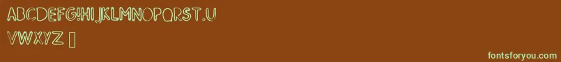 SkMildred-Schriftart – Grüne Schriften auf braunem Hintergrund