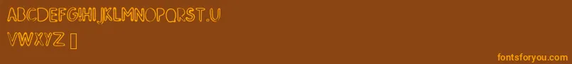 SkMildred-fontti – oranssit fontit ruskealla taustalla