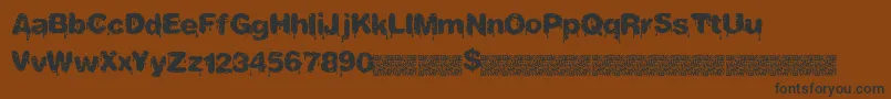 フォントTastydrips – 黒い文字が茶色の背景にあります