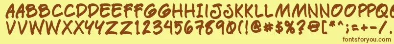 フォントPaetrb – 茶色の文字が黄色の背景にあります。