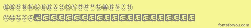 SkullCapzBrk-fontti – harmaat kirjasimet keltaisella taustalla
