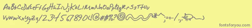 フォントAlphamackAoe – 黄色の背景に灰色の文字