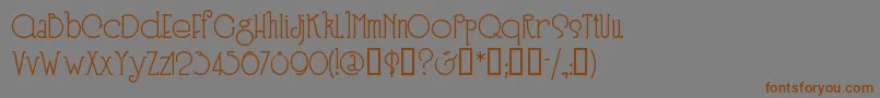 フォントSpeedballno3 – 茶色の文字が灰色の背景にあります。