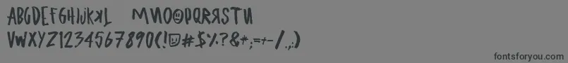 フォントUglyboyAspekhndz – 黒い文字の灰色の背景