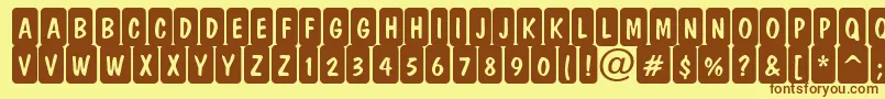 DominottlcmrndcrnRegular Font – Brown Fonts on Yellow Background