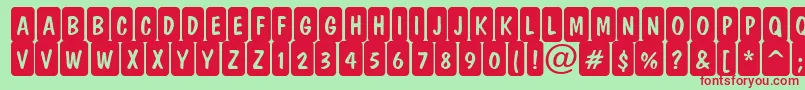 DominottlcmrndcrnRegular Font – Red Fonts on Green Background