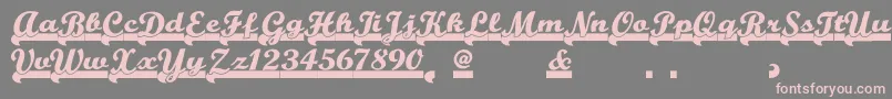 Teamspiritnf-Schriftart – Rosa Schriften auf grauem Hintergrund