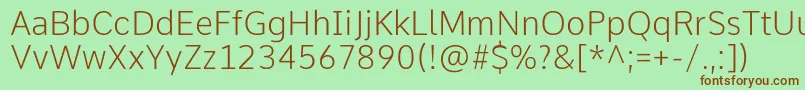 Czcionka CommeExtralight – brązowe czcionki na zielonym tle