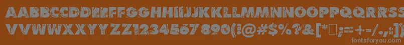 BenKrush-fontti – harmaat kirjasimet ruskealla taustalla