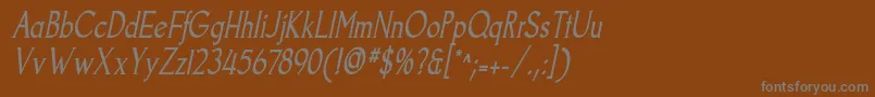 GoodfishItalic-fontti – harmaat kirjasimet ruskealla taustalla
