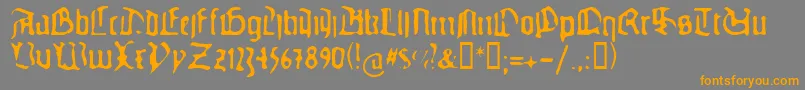 フォントGuteg – オレンジの文字は灰色の背景にあります。