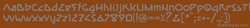 ImmuneBold-fontti – harmaat kirjasimet ruskealla taustalla