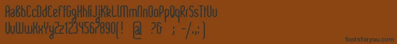 Rajkeys Font – Black Fonts on Brown Background