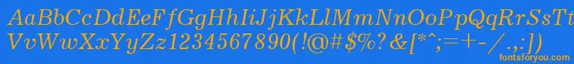 フォントJournalItalicCyrillic – オレンジ色の文字が青い背景にあります。