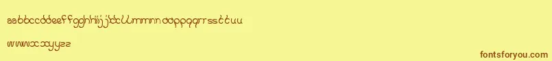 フォントKeepQuietAndSimple – 茶色の文字が黄色の背景にあります。