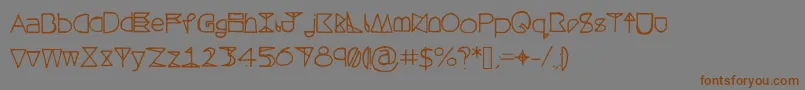 フォントQuestrahollow – 茶色の文字が灰色の背景にあります。