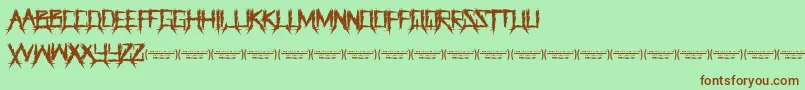 ThegrinderRegular Font – Brown Fonts on Green Background