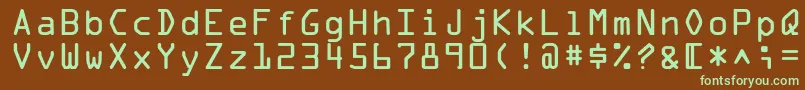 フォントOcraLtAlternate – 緑色の文字が茶色の背景にあります。