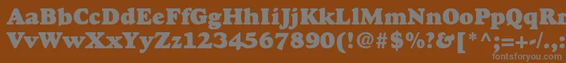 GoudystdHeavyface-Schriftart – Graue Schriften auf braunem Hintergrund