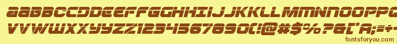 フォントOzdalaserital – 茶色の文字が黄色の背景にあります。