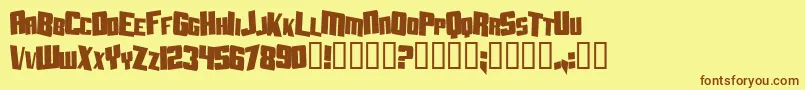 フォントAftershockDebrisCondsolid – 茶色の文字が黄色の背景にあります。