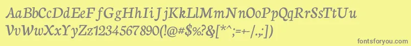 フォントNeutonCursive – 黄色の背景に灰色の文字