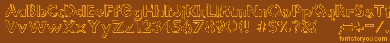フォントPunkRockRummageSale – オレンジ色の文字が茶色の背景にあります。