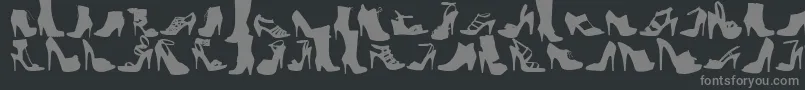 WcFetishistBta-fontti – harmaat kirjasimet mustalla taustalla