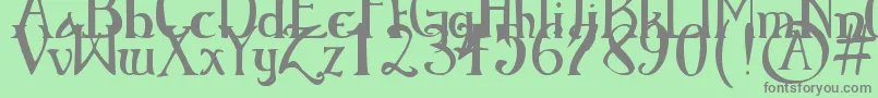 ElementaryGothicBookhand Font – Gray Fonts on Green Background